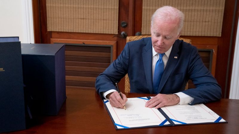 Biden signs the government spending bill.
