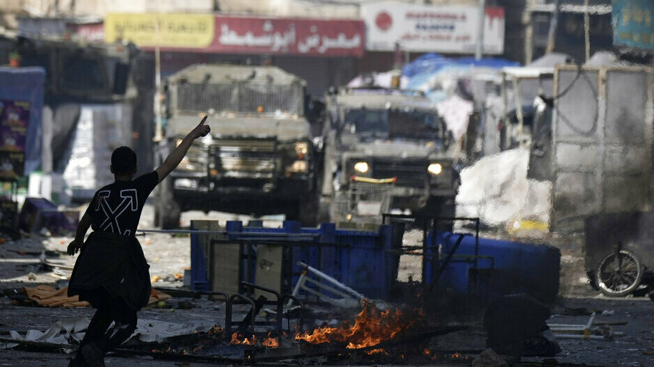 Israel says that a man rammed his car into a group of people