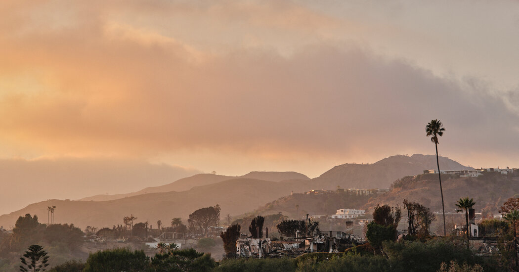 Officials warn of mudslides and toxic ash as rain gives LA wildfire relief